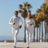 Two people running on a path with palm trees in the background